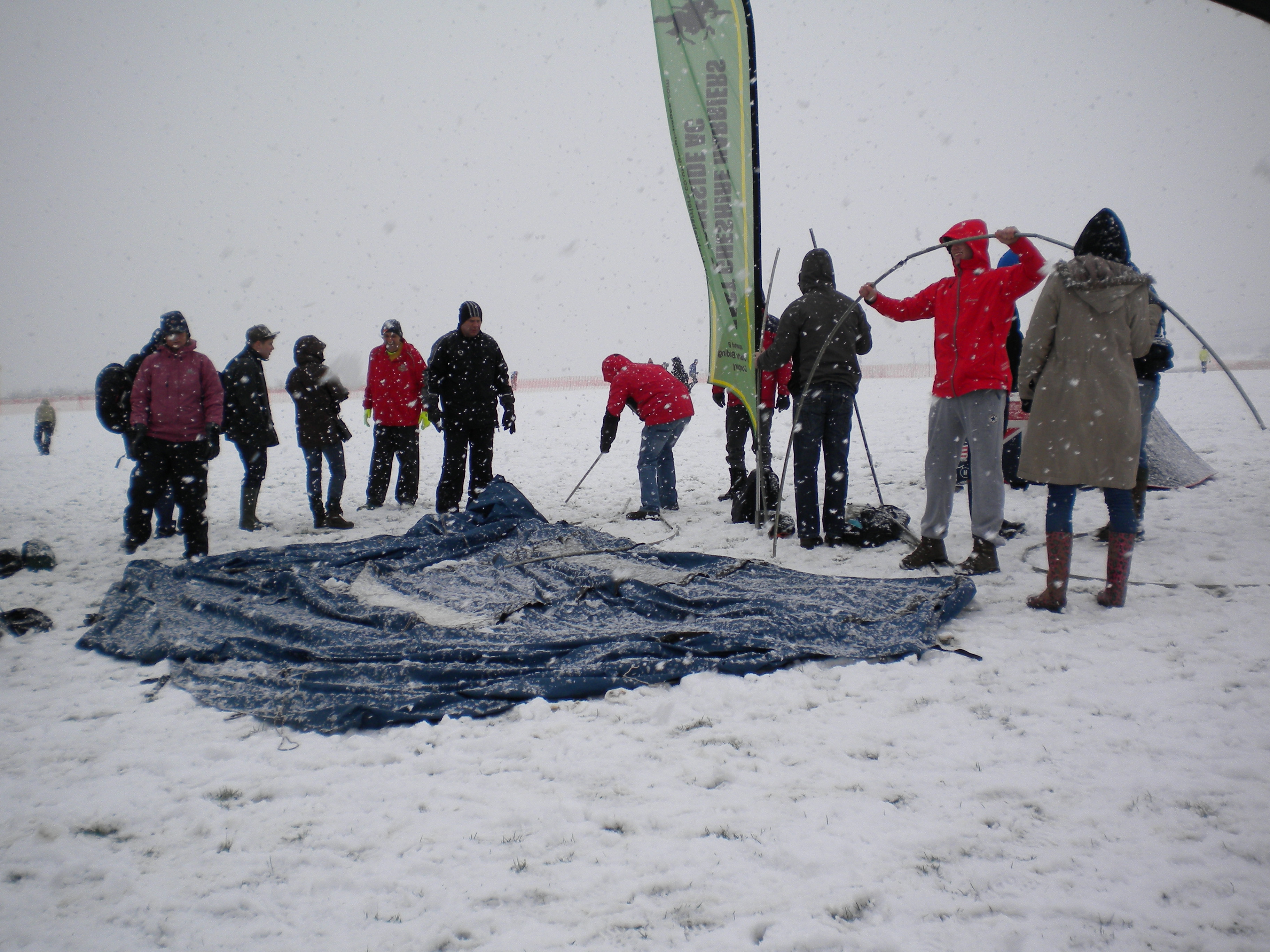 Trying to put up the tent in a blizzard